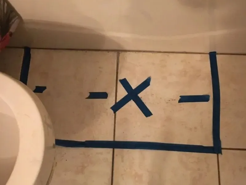 Technician tracing a hidden water leak inside a Carlsbad, California home